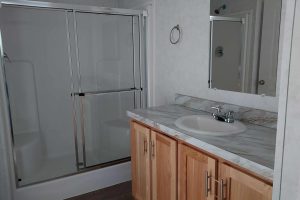 A bathroom vanity and shower
